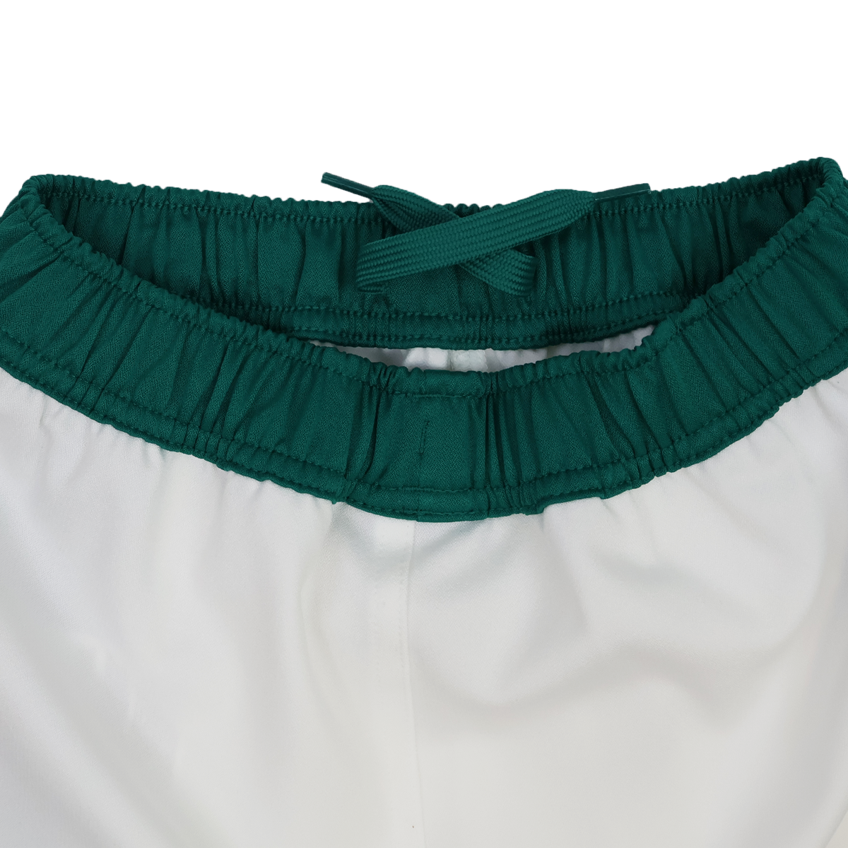 Close-up of the waistband on the Youth Ireland 25/26 Home Match Short by Canterbury, showing a dark green elastic band and matching drawstring.