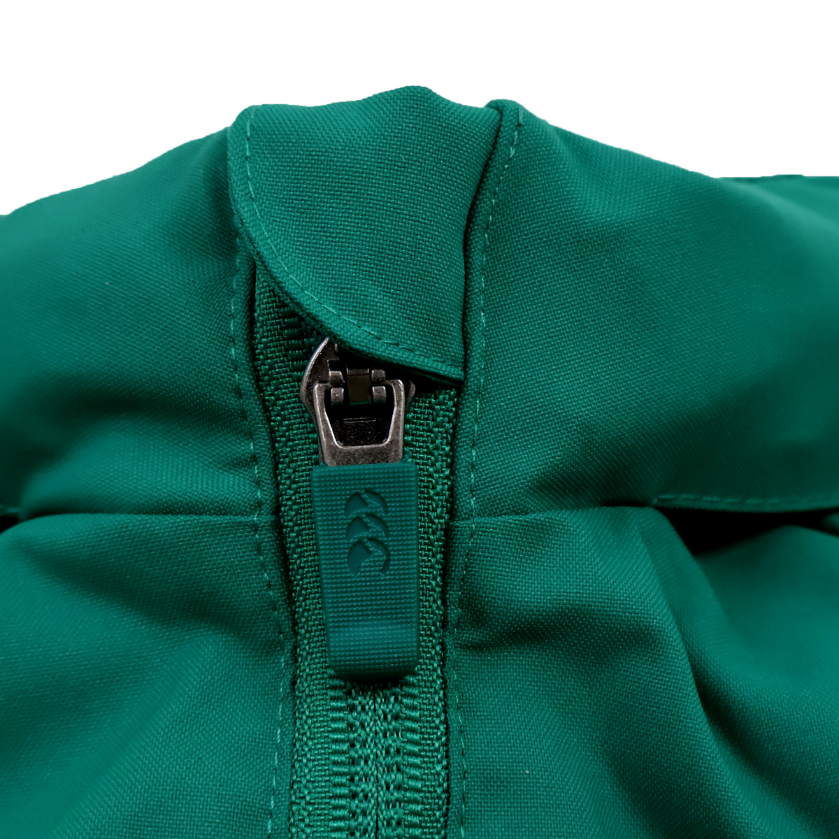 Close-up of the Youth Ireland 25/26 Anthem Track Jacket by Canterbury, featuring a central zipper with a rubber pull and visible stitching.