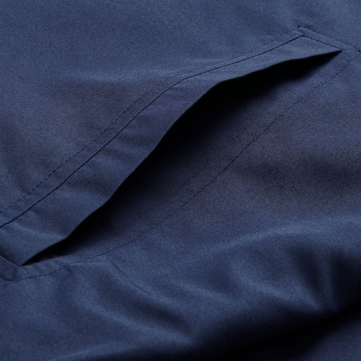 Close-up of the Ireland 26 Legends 1/4 Zip Jacket by Canterbury in navy blue, highlighting a single welt pocket with neat stitching.