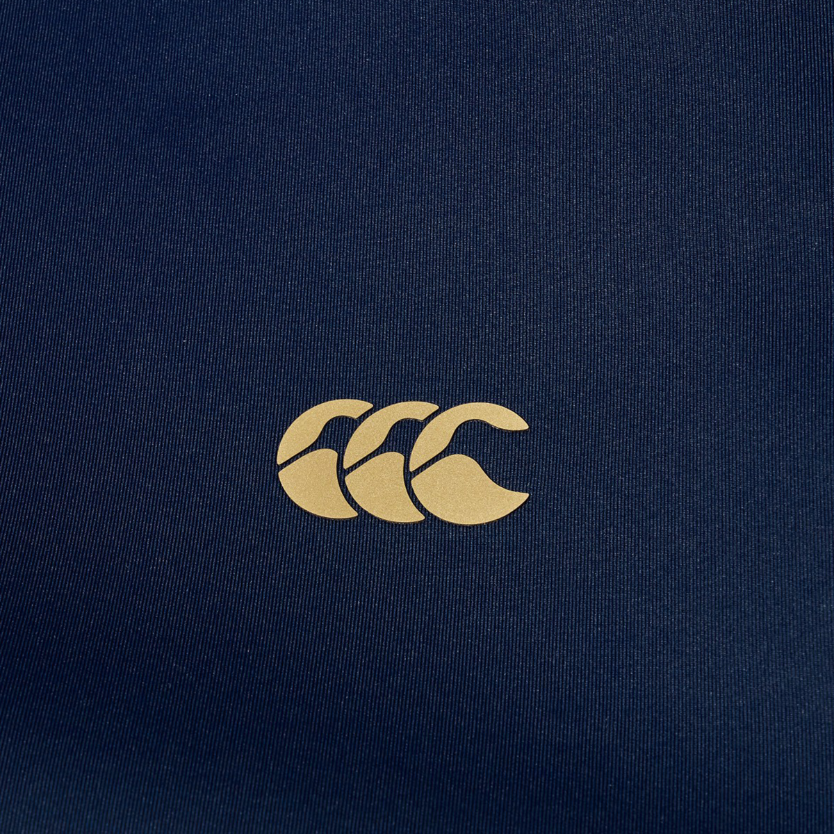 The Canterbury Everest Full Zip Hoodie features a beige Canterbury logo with three overlapping Cs on navy blue fabric, combining style and performance for your rugby training needs.