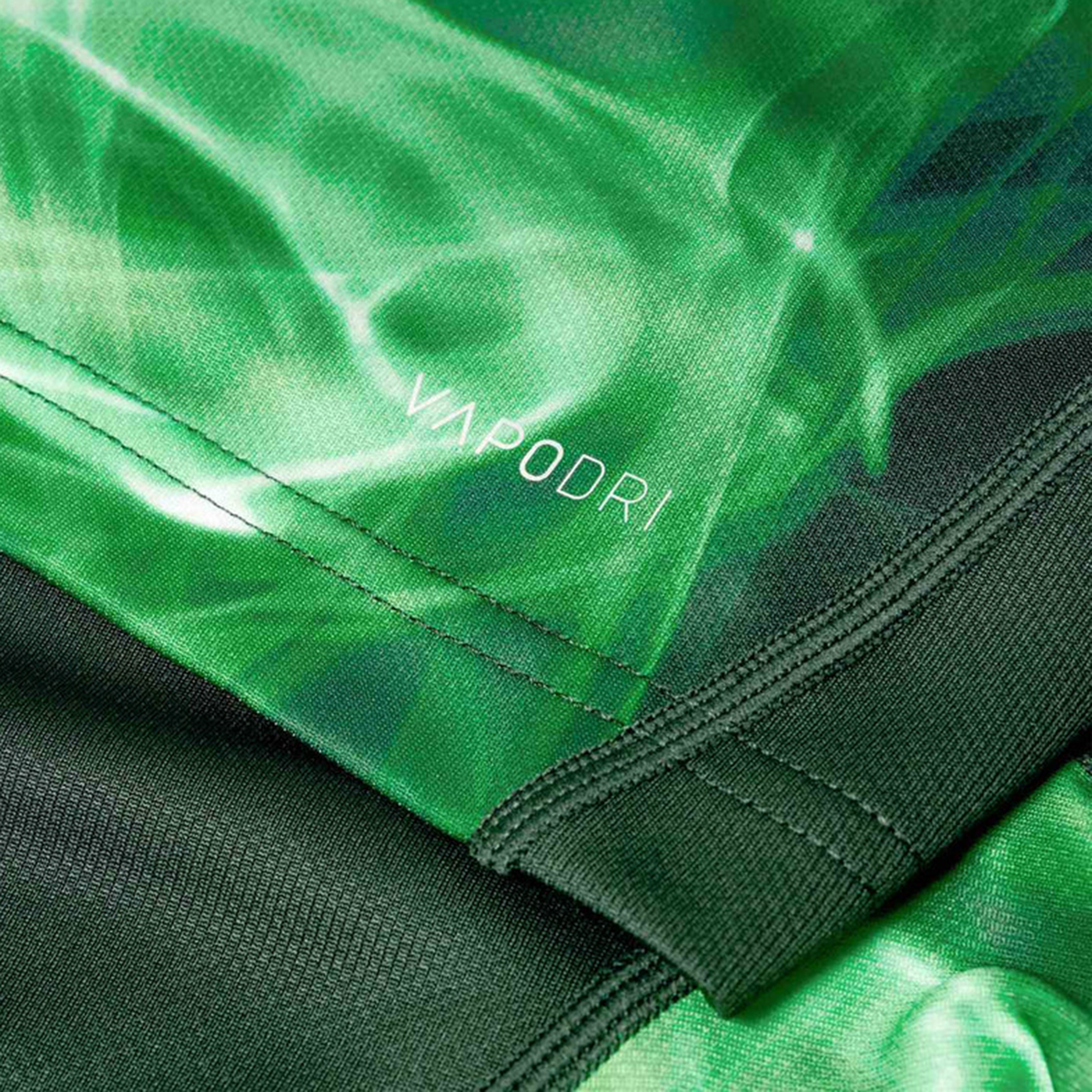 Close-up of the Limited Edition Ireland "Chicago" Pro Pre-Game Jersey by Canterbury, showing green sports fabric with "VAPODRI" print, detailed stitching, and texture that showcases VapoDri technology.