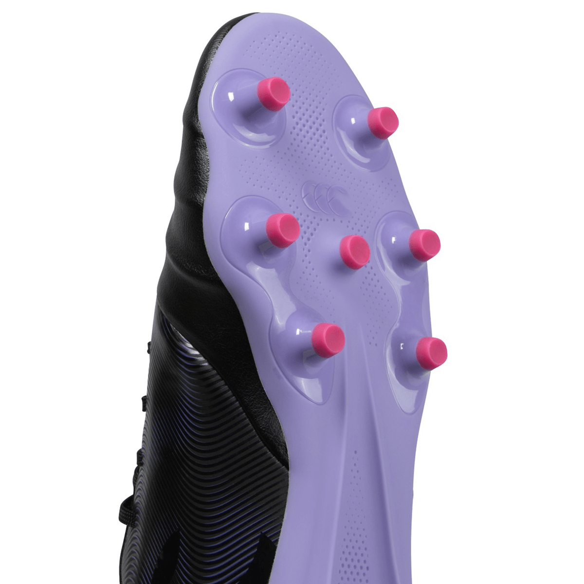 Close-up of a black Canterbury Phoenix Genesis Team FG soccer cleat with a Vaposkin, purple sole, and pink studs.