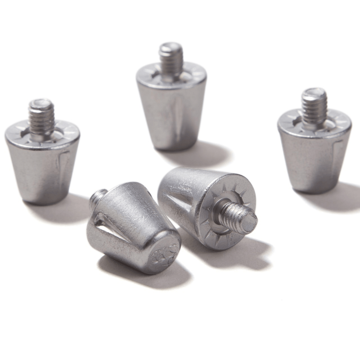 Five Canterbury Short Performance Studs with threaded tops are arranged on a white surface.