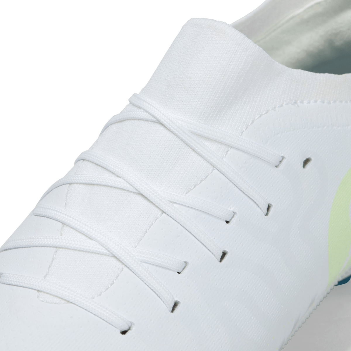 Close-up of a Canterbury Speed Infinite Pro SG - White/Luminous boot with laces, marketed as Canterbury Speed Infinite Pro soft-ground cleats.