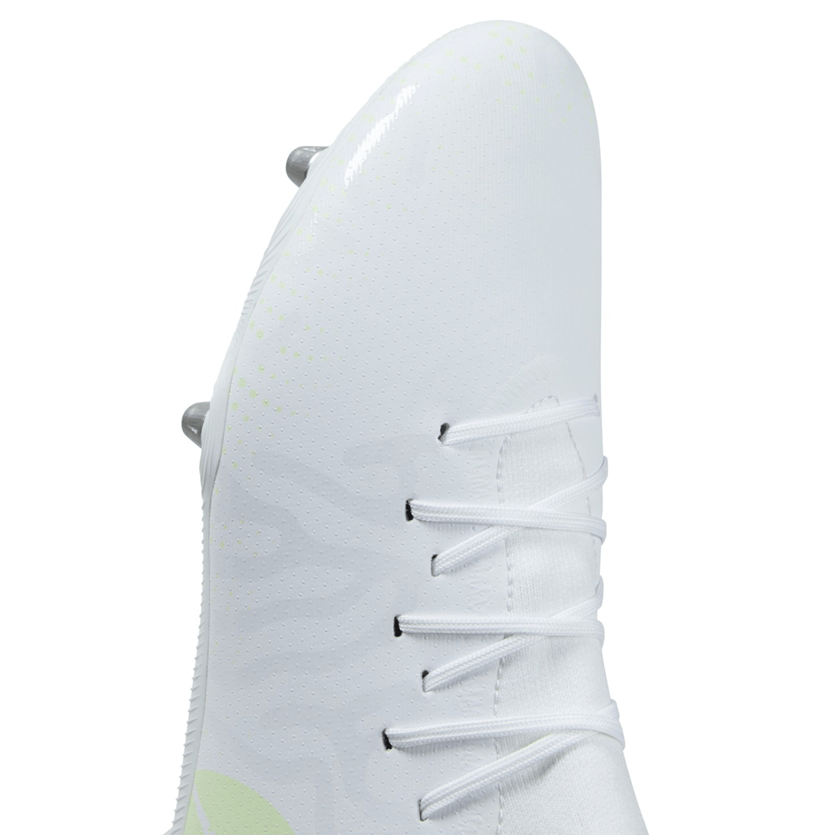 Close-up of a white Canterbury Speed Infinite Pro SG, a lightweight boot with laces and soft-ground cleats.