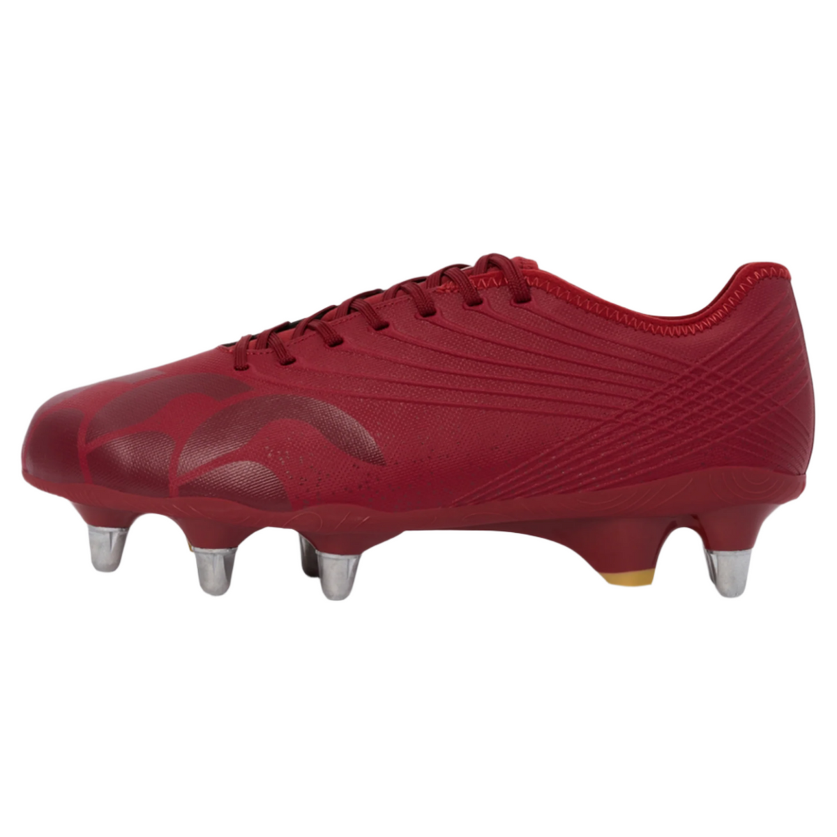 The Canterbury Stampede Groundbreak Pro SG - Red Dahlia rugby boot features laces, four front and two rear metal studs for soft ground play, and is shown in side profile.