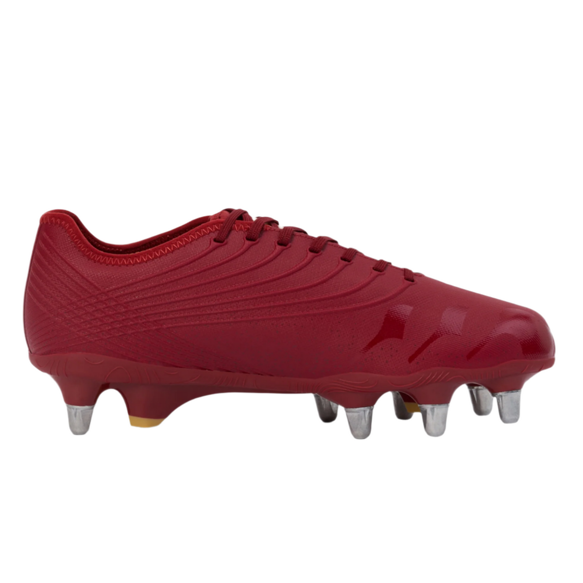 The Canterbury Stampede Groundbreak Pro SG - Red Dahlia rugby boot features metal studs and textured detailing, designed for soft ground. Shown in side profile on a white background.