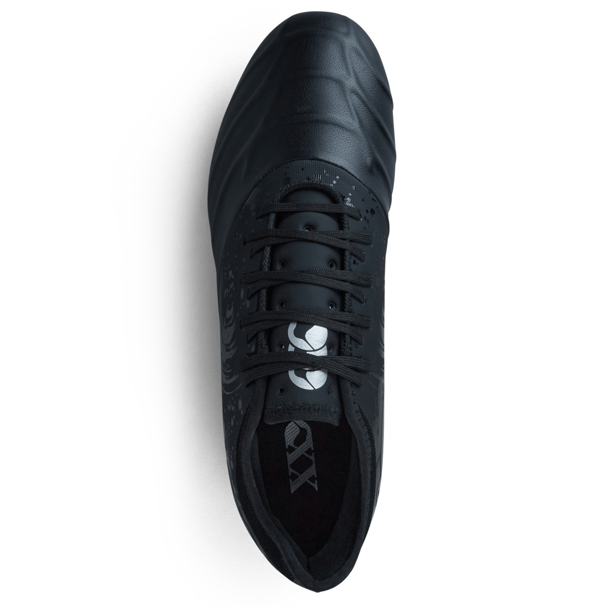 The Canterbury Phoenix Genesis Pro FG in Black/Silver Metallic, seen from above, features a textured design on its surface with TPU-reinforced mesh for enhanced durability.