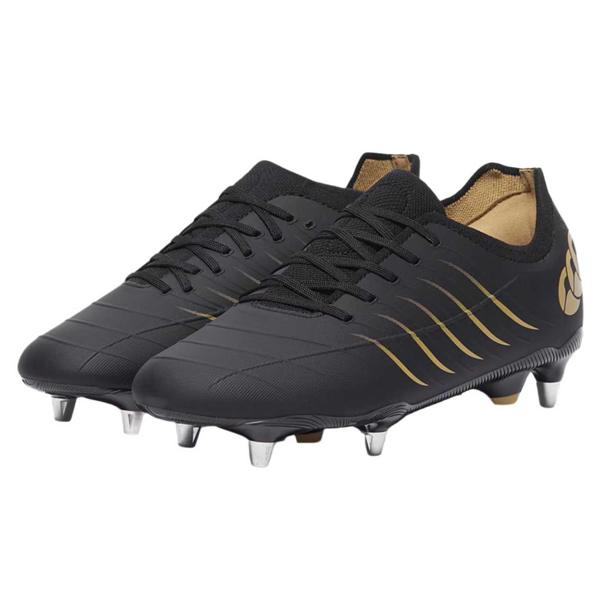 The Canterbury Phoenix 2.0 Pro SG rugby boots in black, featuring gold accents and metal studs for soft ground, are displayed on a white background.
