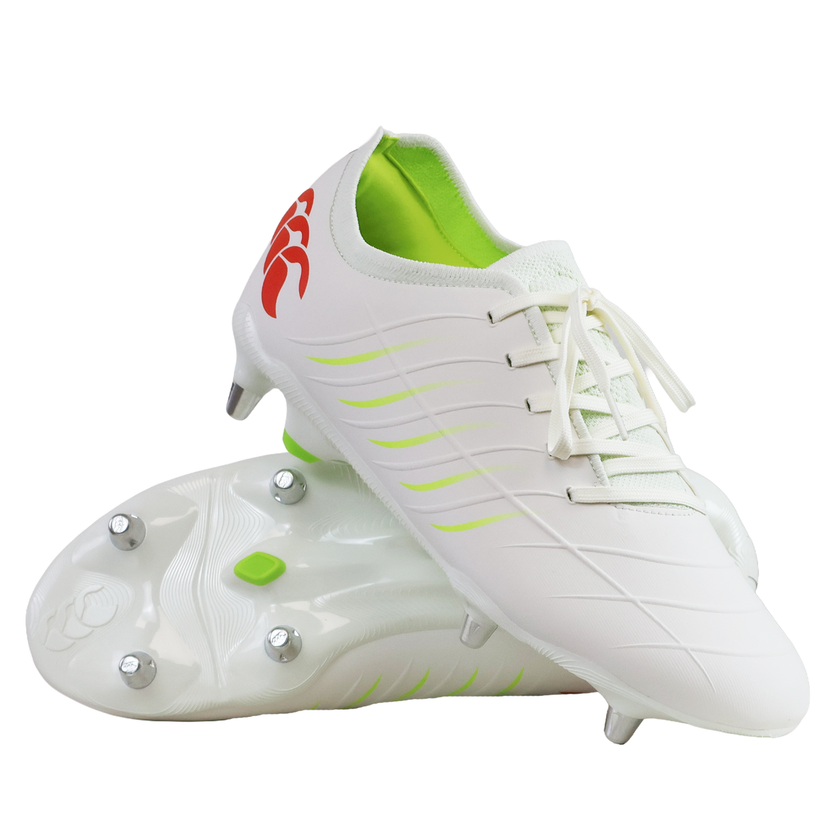The Canterbury Phoenix 2.0 Pro SG rugby boots in Snow White/Tangerine Tango feature green accents, metal studs, and a red logo on the heel, shown against a white background.