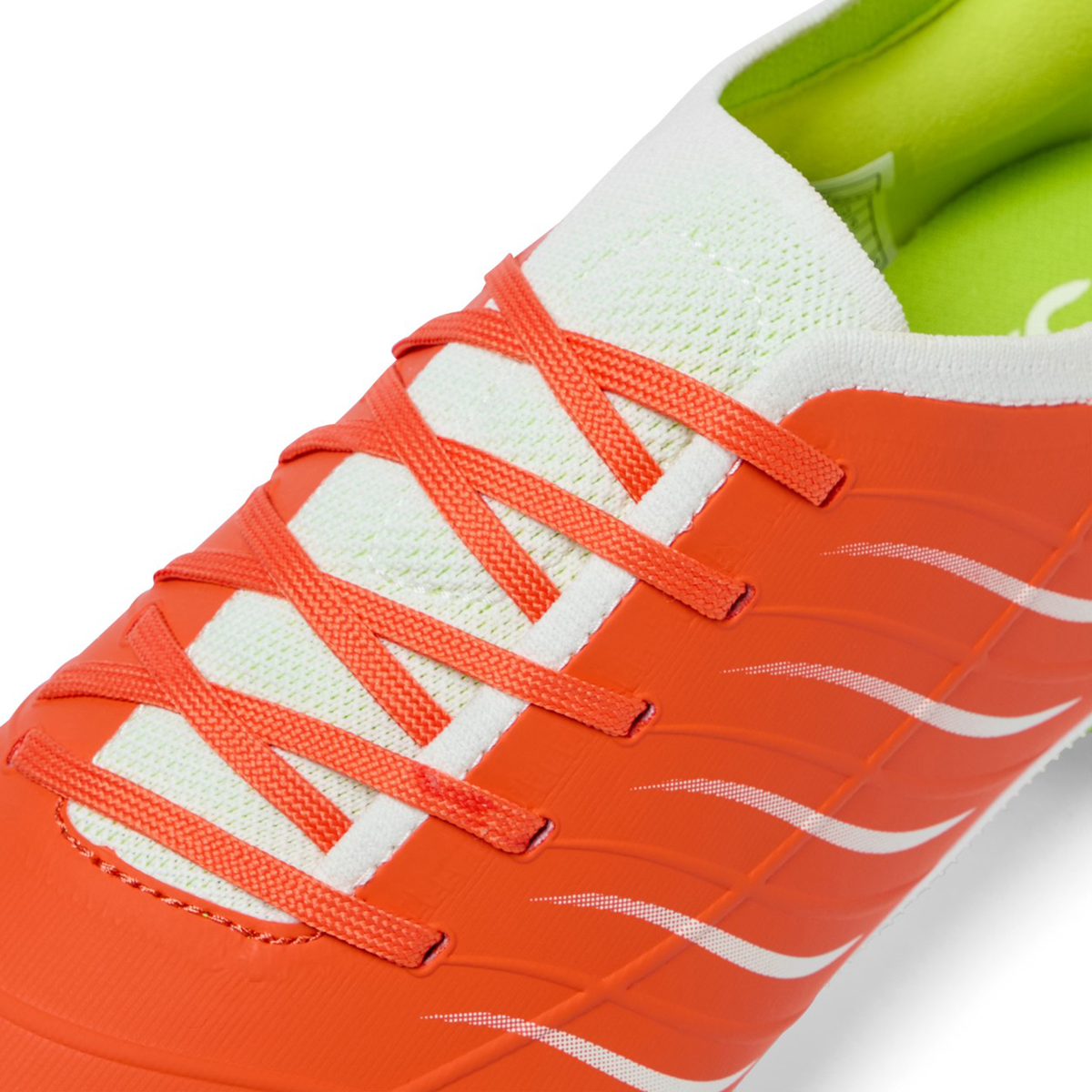 Close-up of the Canterbury Phoenix 2.0 Pro SG rugby boot in Tangerine Tango/Snow White by Canterbury, featuring vibrant orange with white accents, orange laces, and a light green inner lining for soft ground play.