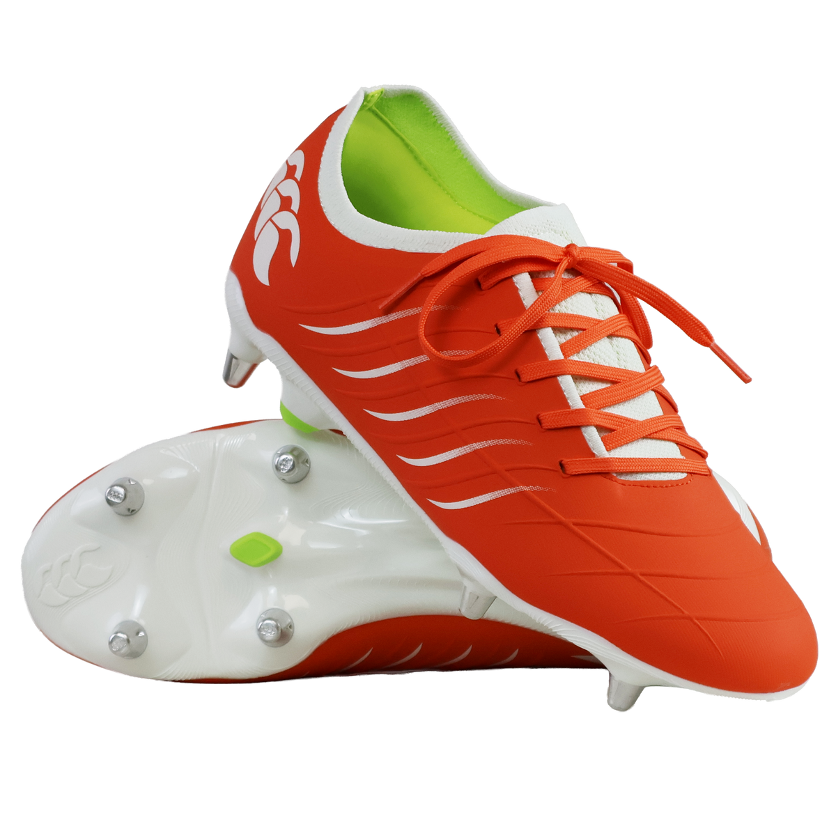 The Canterbury Phoenix 2.0 Pro SG boots in Tangerine Tango/Snow White feature green inner lining; one stands upright, the other lies on its side, displaying metal studs that highlight their durable sports design.