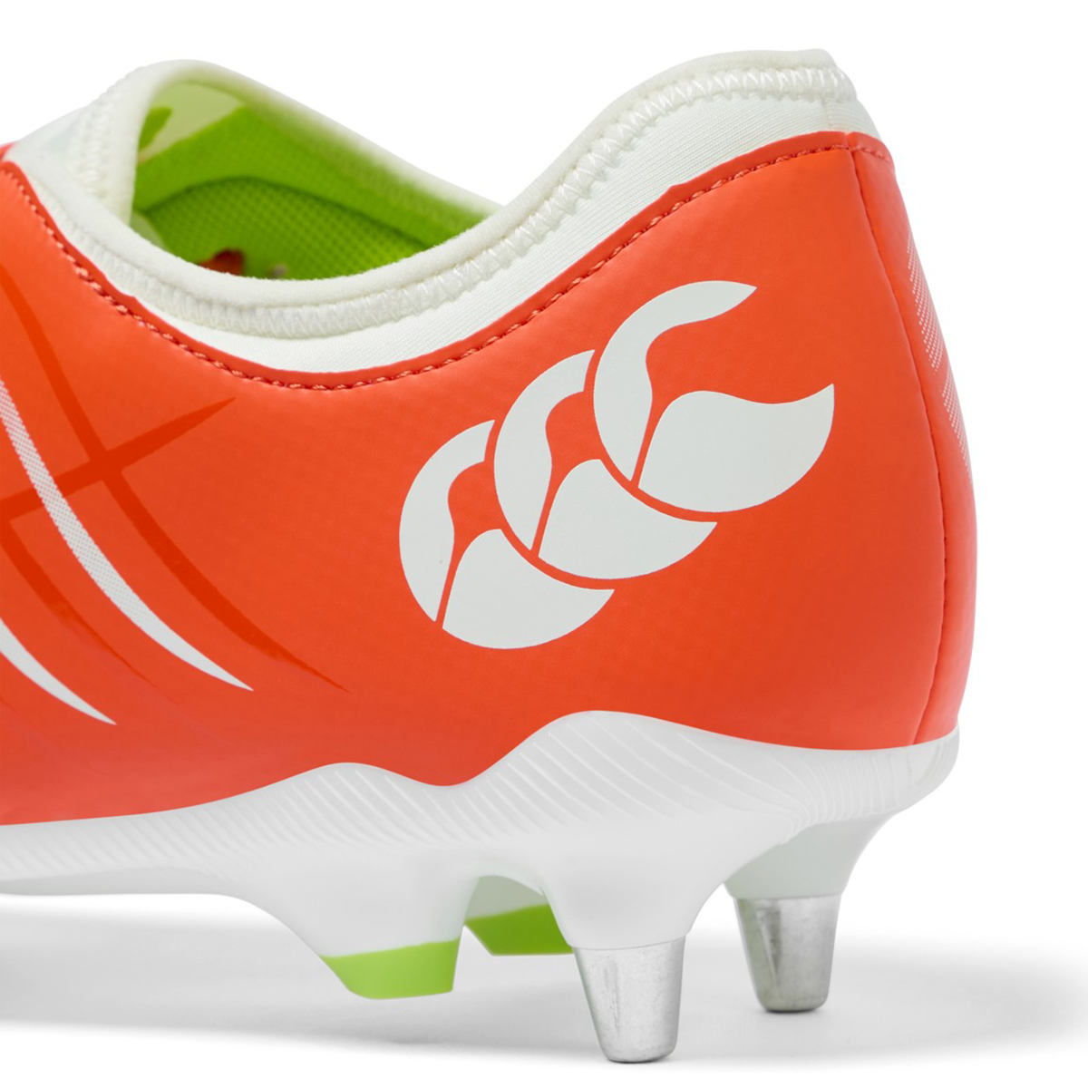 Close-up of the Canterbury Phoenix 2.0 Team SG rugby boot in Tangerine Tango/Snow White, featuring a white Canterbury logo and metal studs for optimal grip on soft, wet ground.