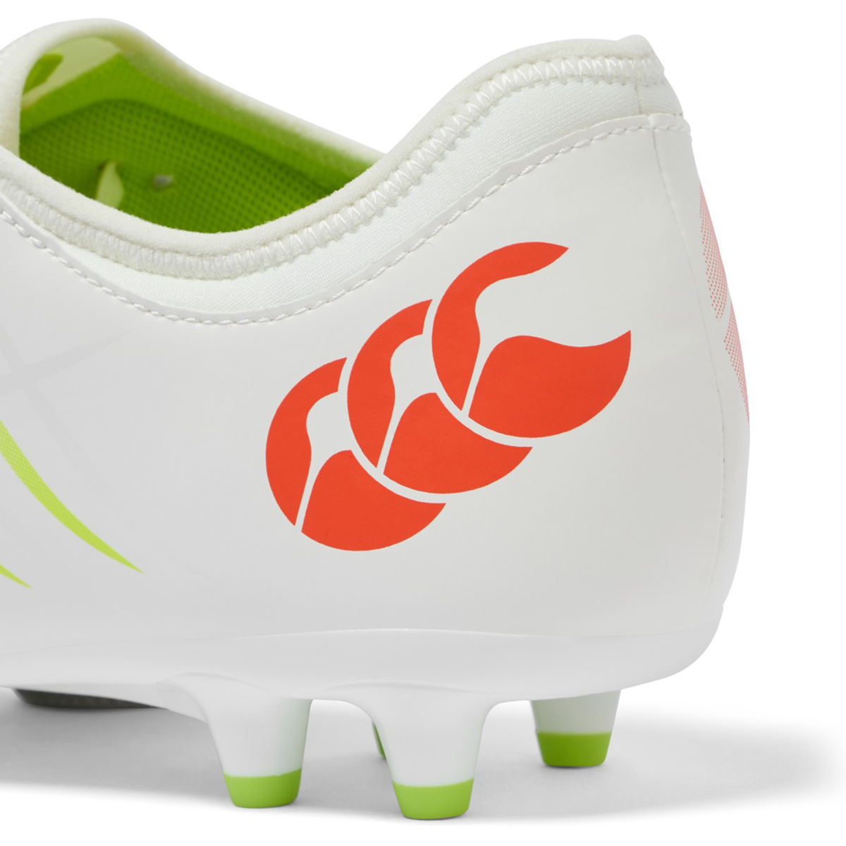 Close-up of the Canterbury Phoenix 2.0 Team FG in Snow White/Tangerine Tango, highlighting the durable heel design and reliable firm ground traction from Canterbury football boots.
