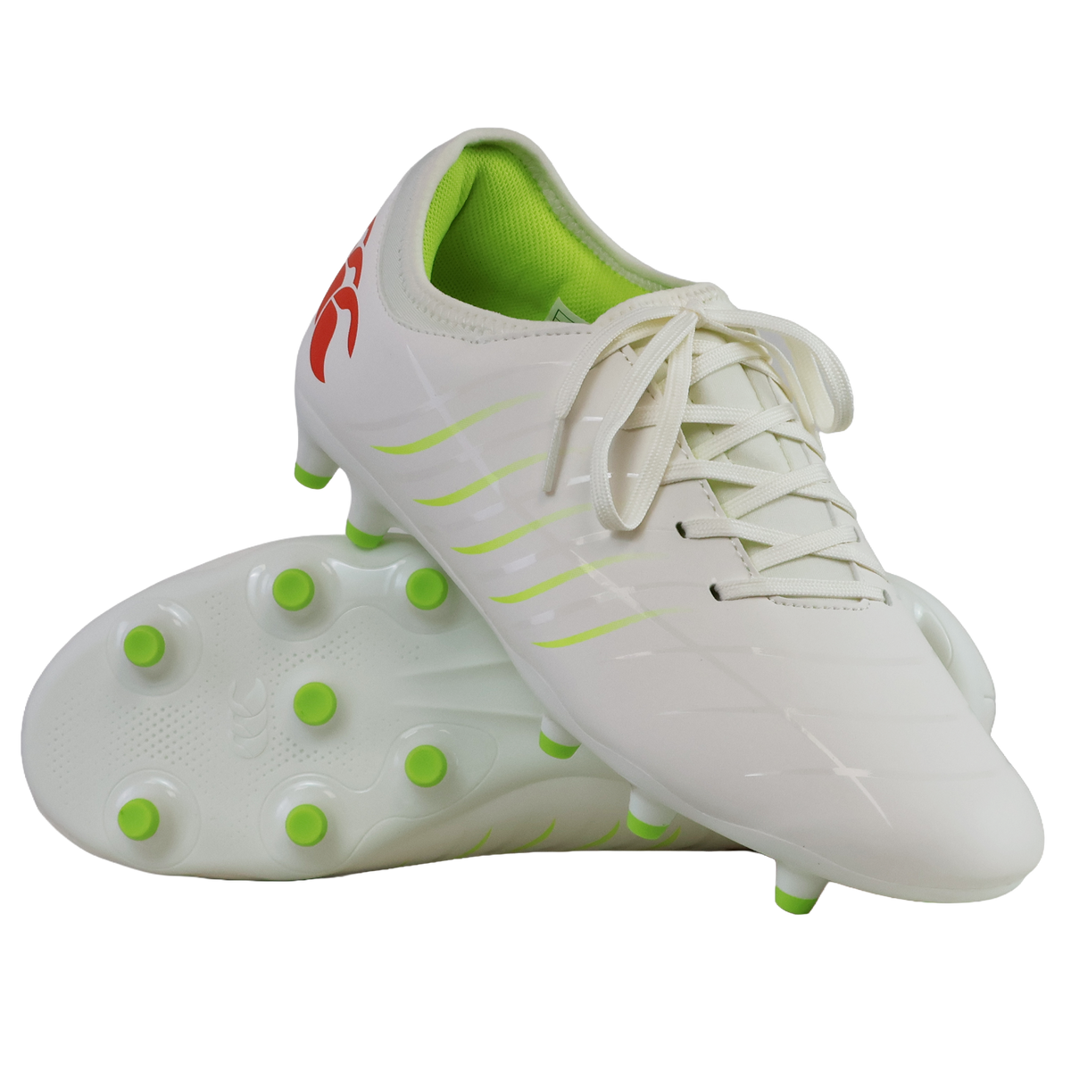 The Canterbury Phoenix 2.0 Team FG football boots in Snow White/Tangerine Tango feature a durable white design, green studs and accents, a red logo on the heel, with one boot shown upright and the other on its side.