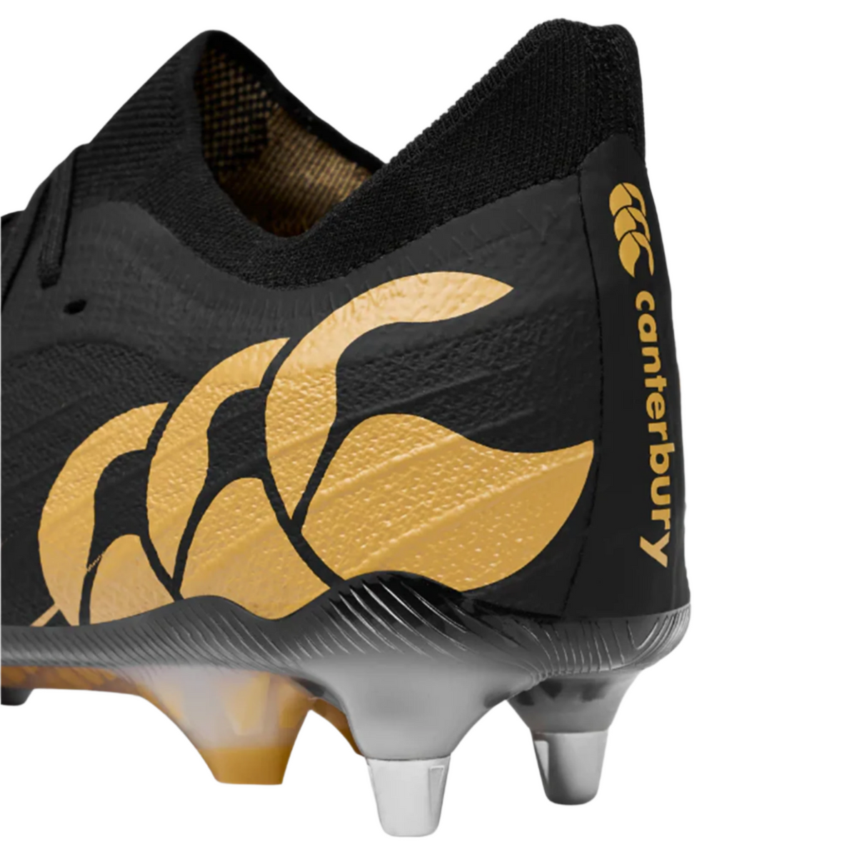 Close-up of the heel on the Canterbury Speed Falcon Team SG - Black rugby boots, showing metal soft ground studs and bold Canterbury branding on the side.