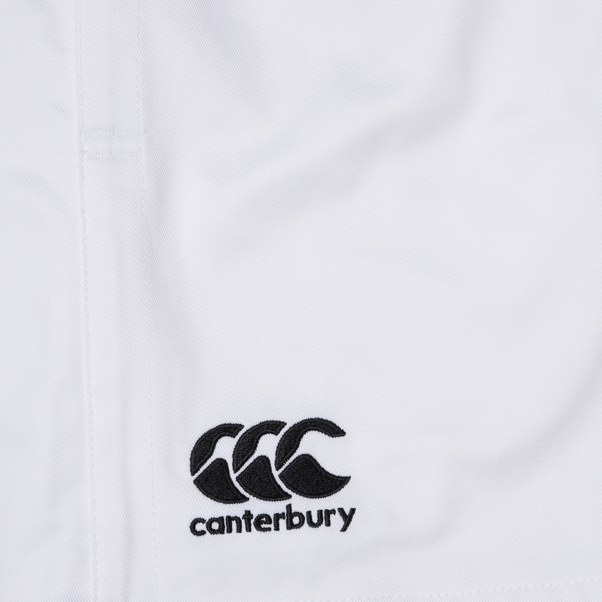 The Canterbury Professional Cotton Short 3-Pack by Bundle Canterbury features white cotton shorts with an elastic waistband and an embroidered black logo of three intertwined C's above "canterbury.
