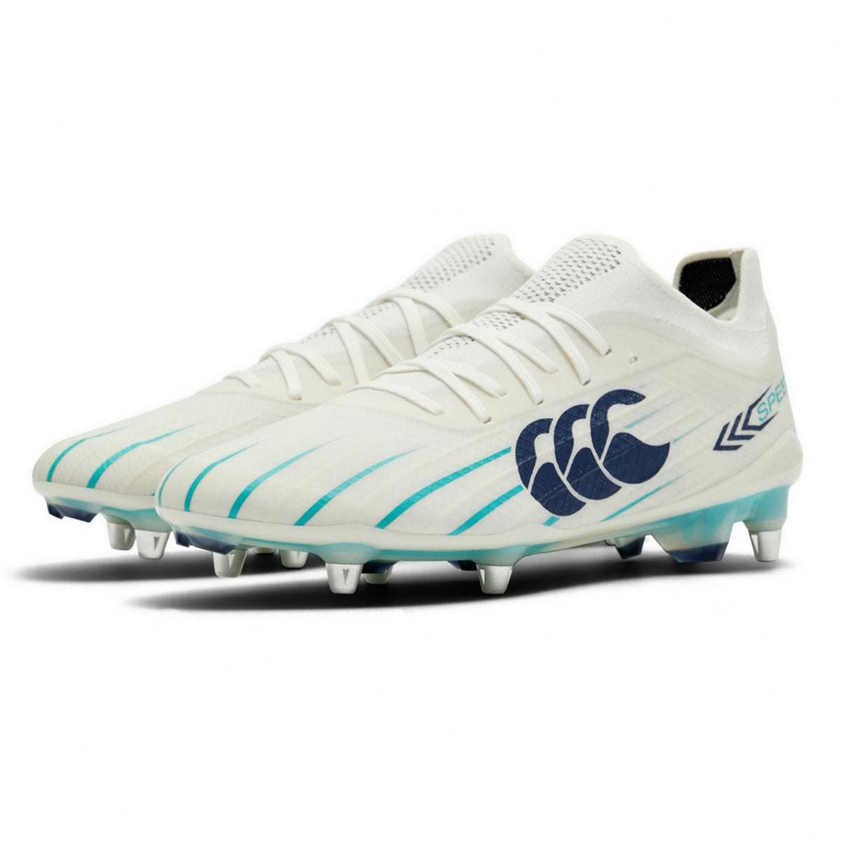 A pair of Canterbury Speed Falcon 2.0 Elite SG rugby boots by Canterbury, showcased in white with Baltic Green accents and equipped with metal studs for superior grip on soft ground, featuring a prominent dark logo on the side, set against a clean white background.
