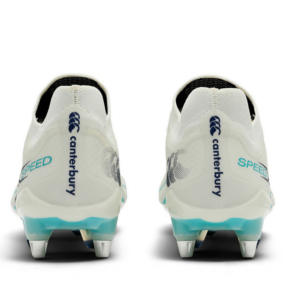 A pair of Canterbury Speed Falcon 2.0 Elite SG rugby boots in White/Baltic Green, viewed from the back, highlighting metal studs for soft ground and featuring the distinctive Canterbury branding.