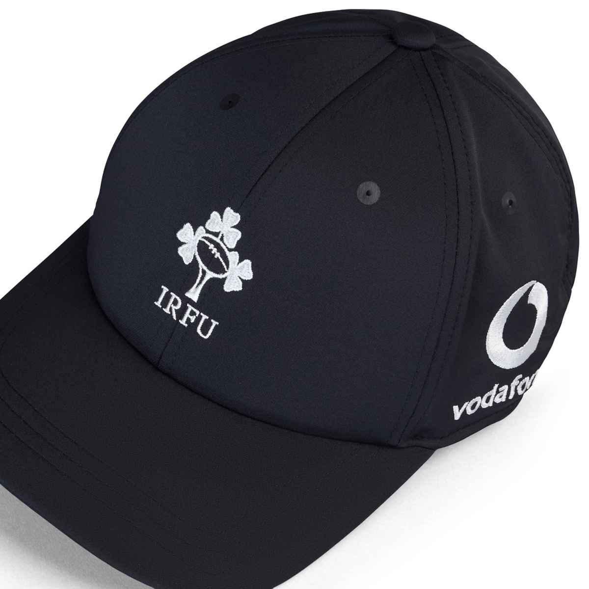 The Ireland 25/26 Tech Logo Cap by Canterbury is a black adjustable sports cap featuring the IRFU design on the front and Vodafone branding on the side.