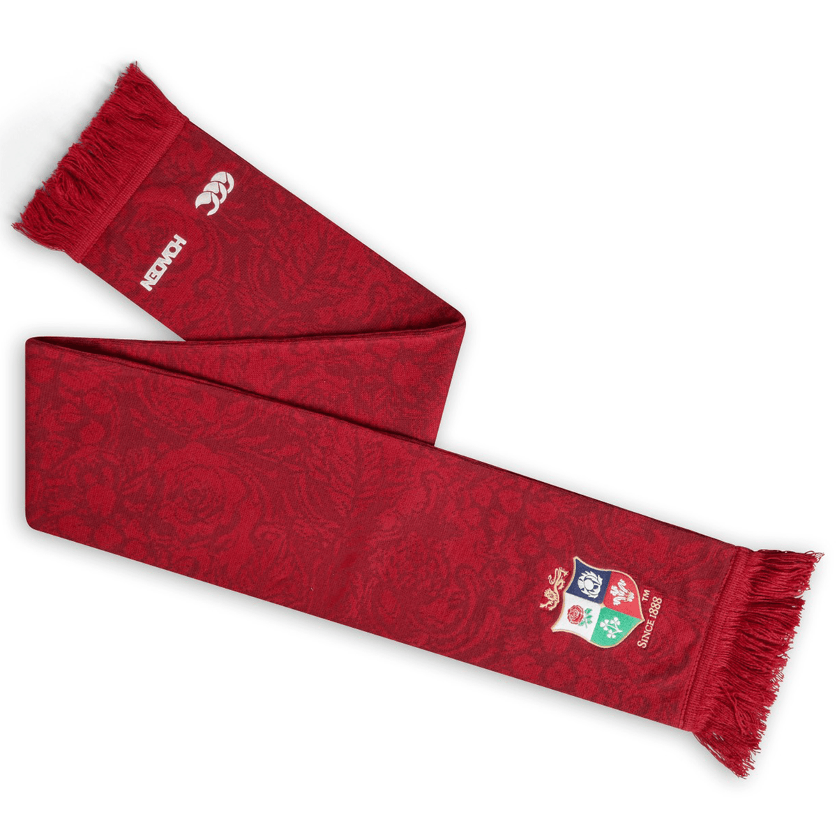 Display your pride with the British &amp; Irish Lions 2025 Supporters Scarf by Canterbury, showcasing the iconic crest. This red scarf, embellished with fringe ends, a subtle pattern, and BIL branding, is an ideal accessory for any devoted fan.