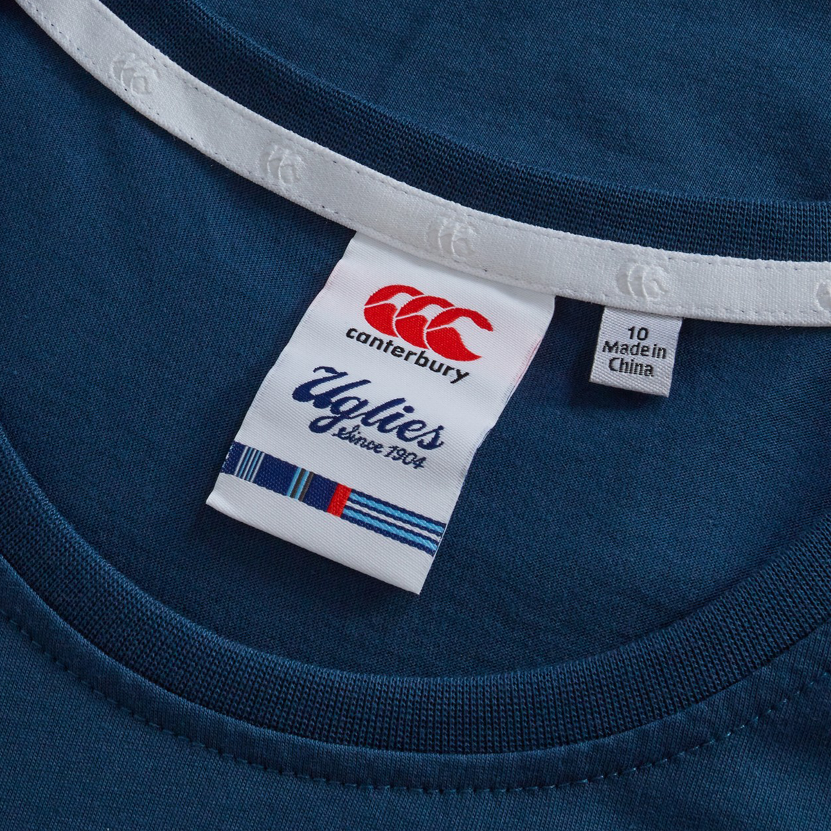 A close-up of the Canterbury Women&#39;s Uglies Logo T-Shirt showcases its bold design—an iconic addition to women&#39;s rugby apparel.