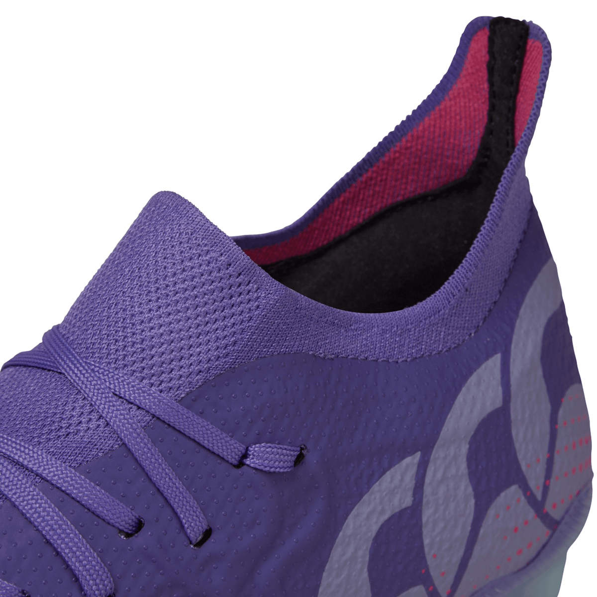 Close-up of a Canterbury Speed Infinite Elite FG sports shoe in Prism Violet/Verbena with laces and a patterned design.
