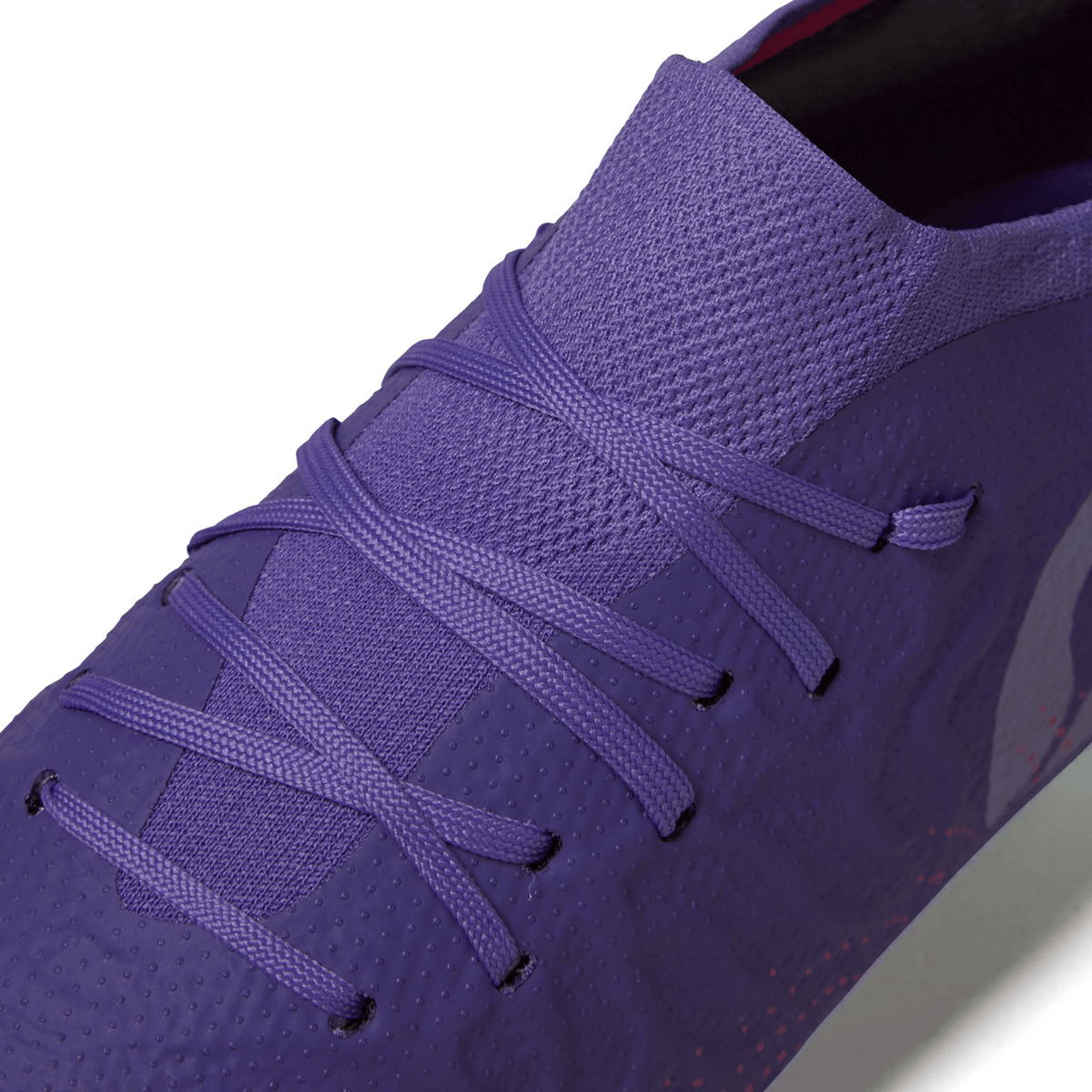 Close-up of a Canterbury Speed Infinite Elite FG - Prism Violet/Verbena athletic shoe with lightweight boots and laces.