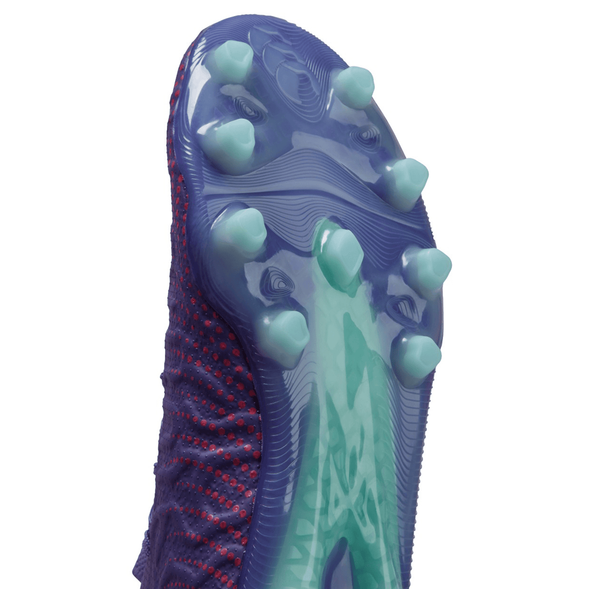 Close-up of a textured blue and purple Canterbury shoe sole with pronounced rubber cleats, featuring a lightweight VAPOSKIN membrane for faster acceleration.